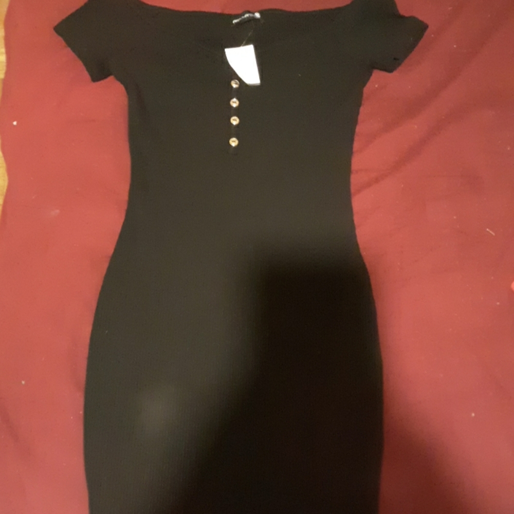 Black hour glass shaped dress.